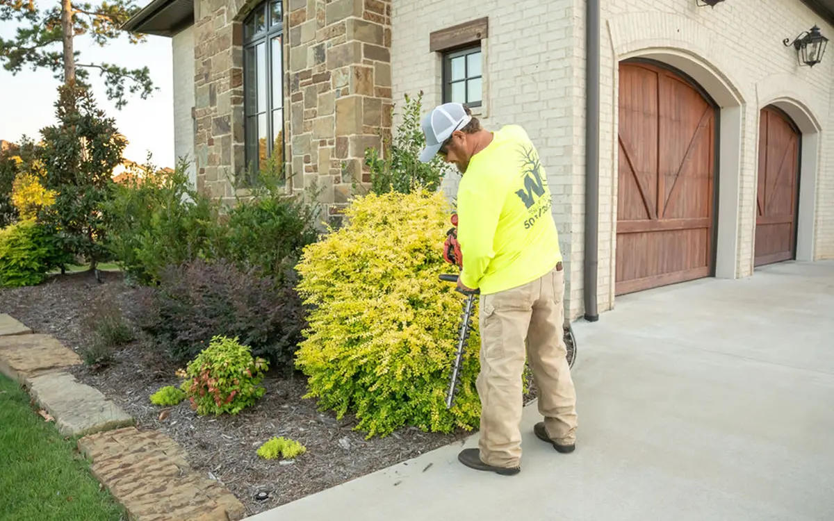 white oak lawn & sprinkler employee edging flower beds